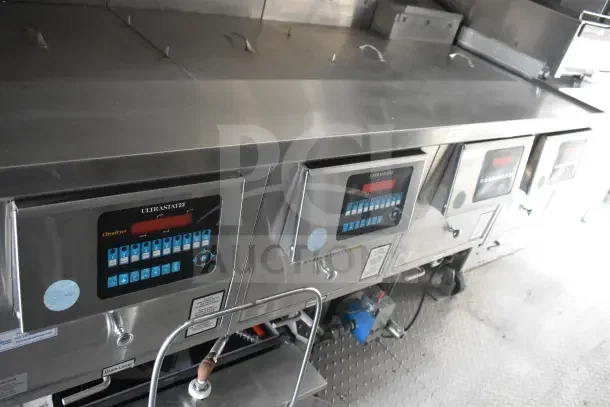 2021 Texino 8.5'x28' food trailer with UltraStat23 control panels, CaptiveAire grease hood, and fire suppression system.
