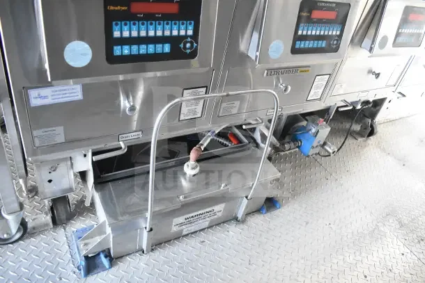 2021 Texino 8.5'x28' food trailer interior with UltraFryer units, grease hood, and fire suppression system.