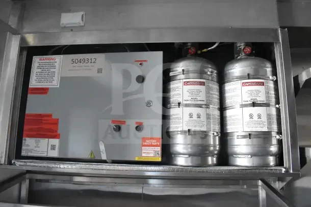 2021 Texino food trailer's CaptiveAire grease hood with fire suppression system, control panel, and tanks visible.