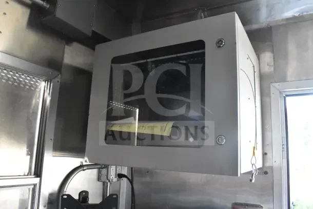 2021 Texino food trailer interior detail showing electrical box and wiring. Clean condition, stainless steel finish.