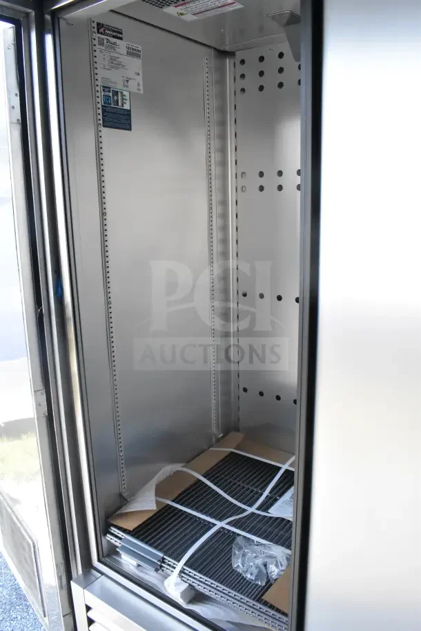 2021 Texino 8.5'x28' food trailer interior, featuring CaptiveAire grease hood, refrigeration, and breading tables.