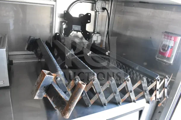 2021 Texino food trailer interior view showing CaptiveAire grease hood components and fire suppression system.
