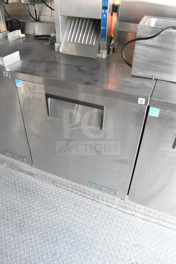 2021 Texino 8.5'x28' food trailer interior with stainless steel refrigeration unit and equipment; clean condition.
