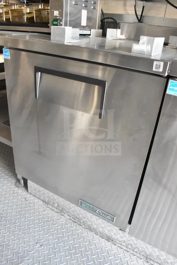 2021 Texino food trailer with CaptiveAire grease hood, fire suppression, refrigeration, and breading tables.