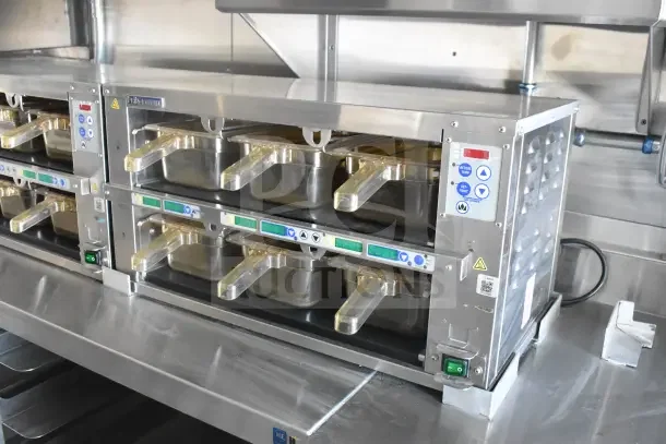 2021 Texino 8.5'x28' food trailer interior, featuring CaptiveAire grease hood, fire suppression, and refrigeration units.