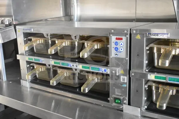 2021 Texino food trailer interior with Prince Castle warming bins, stainless steel, CaptiveAire grease hood visible.