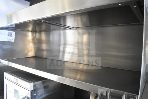 2021 Texino 8.5'x28' food trailer interior with CaptiveAire grease hood, fire suppression, stainless steel surfaces.