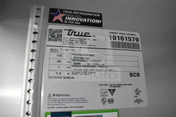 "True refrigeration label shows model T-49-HC specifications, serial number 10161579, voltage, and refrigerant details."