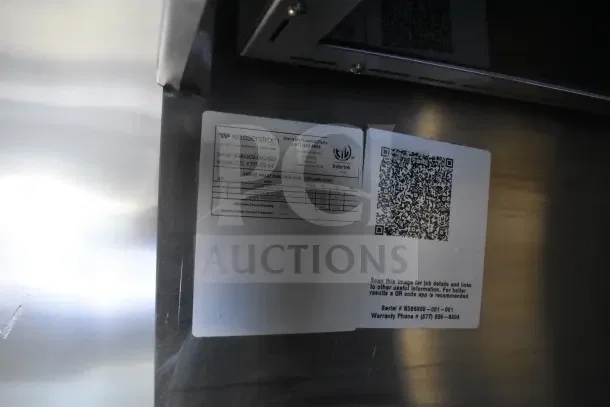 QR code and Wasserstrom label on stainless steel in a Texino food trailer, showing model CJC F775-03-34 and serial 6386309-001-002.