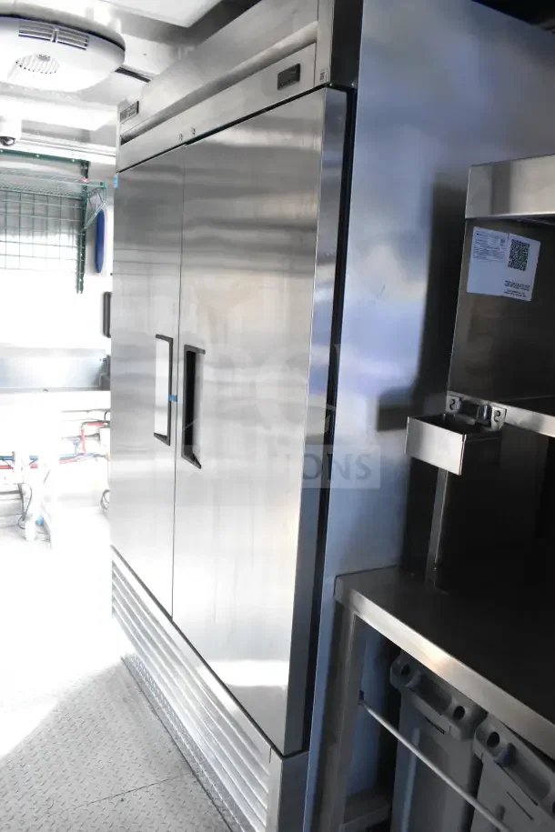 2021 Texino 8.5'x28' food trailer with CaptiveAire grease hood, fire suppression, refrigeration units, and breading tables.