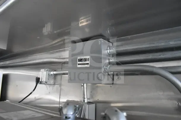 2021 Texino food trailer interior showing electrical wiring and junction box, highlighting the trailer's infrastructure.