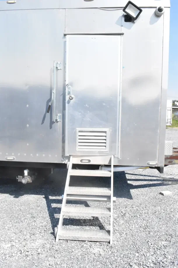 2021 Texino 8.5'x28' food trailer with door and steps, featuring CaptiveAire grease hood.