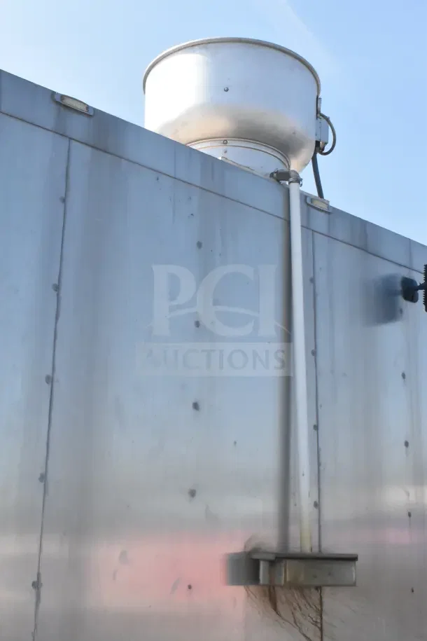 2021 Texino 8.5'x28' food trailer exterior with CaptiveAire grease hood vent, stainless steel surface in good condition.