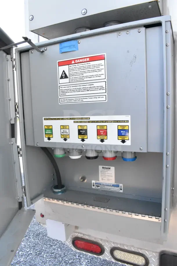 2021 Texino 8.5'x28' food trailer power panel, labeled connections, and safety warnings. Includes CaptiveAire systems.