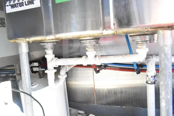 Interior of 2020 Diamond Cargo 24' kitchen trailer showing plumbing and NSF-certified pipes. Equipment described as tested and working.