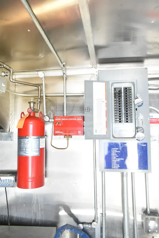 2020 Diamond Cargo 24' kitchen trailer interior showing fire suppression system, control panel, and wiring.