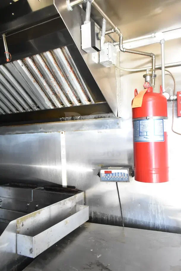 2020 Diamond Cargo 24' kitchen trailer interior featuring grease hood and fire suppression system.