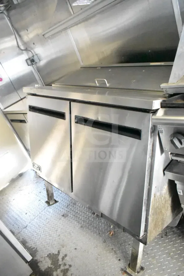 2020 Diamond Cargo 24' kitchen trailer interior with Arctic Air refrigeration unit. Stainless steel finish, clean condition.