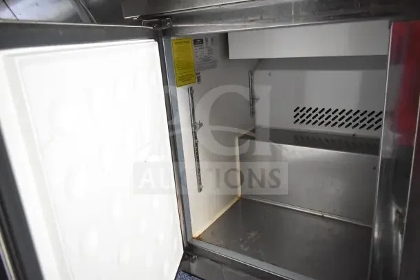2020 Diamond Cargo 24' kitchen trailer interior, showing stainless steel empty refrigeration unit with visible labels.