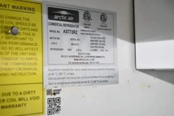 Arctic Air commercial refrigerator label, Model AST72RZ, includes serial, refrigerant details, and manufacturer info.
