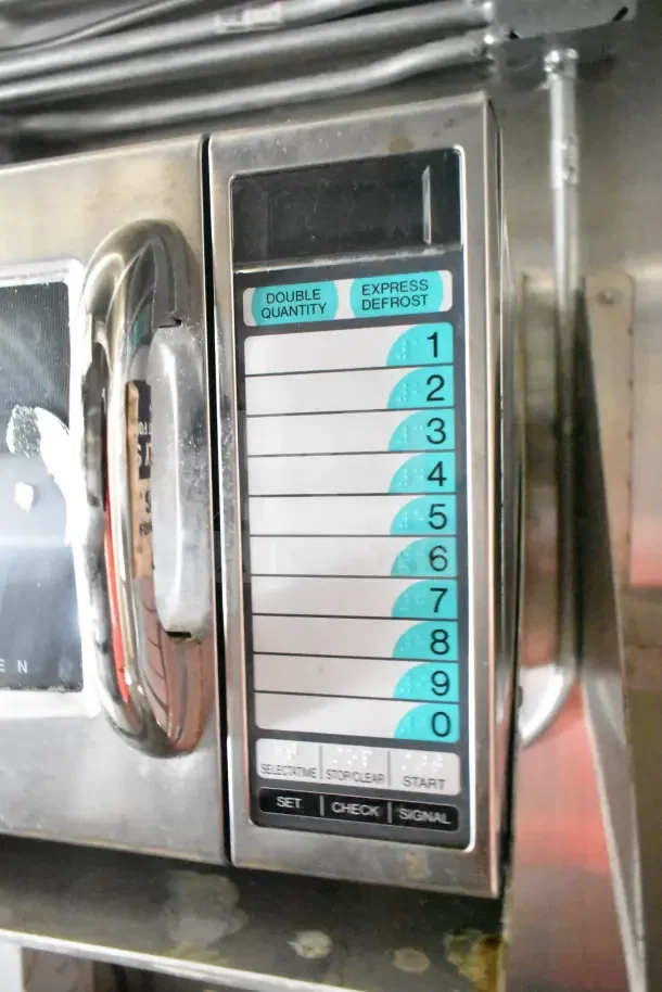 Control panel of a commercial kitchen appliance with buttons for double quantity and express defrost.