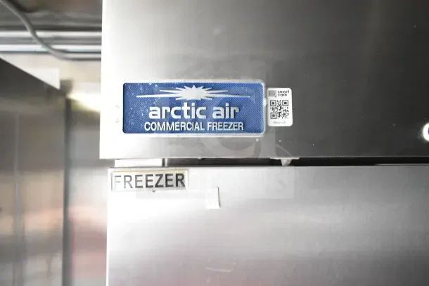 Arctic Air commercial freezer label on 2020 Diamond Cargo kitchen trailer, featuring QR code and "FREEZER" marking.