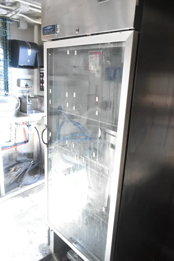 Diamond Cargo 24' kitchen trailer interior with Arctic Air refrigeration unit. Stainless steel finish, in working condition.