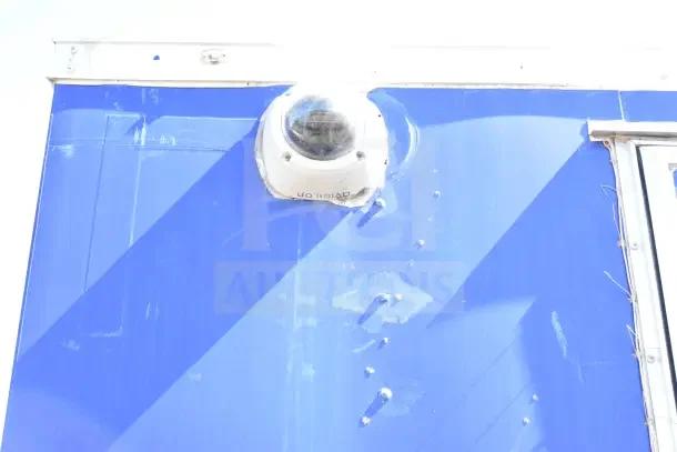 Exterior view of a 2020 Diamond Cargo 24' commercial kitchen trailer in blue, featuring a mounted exterior camera.