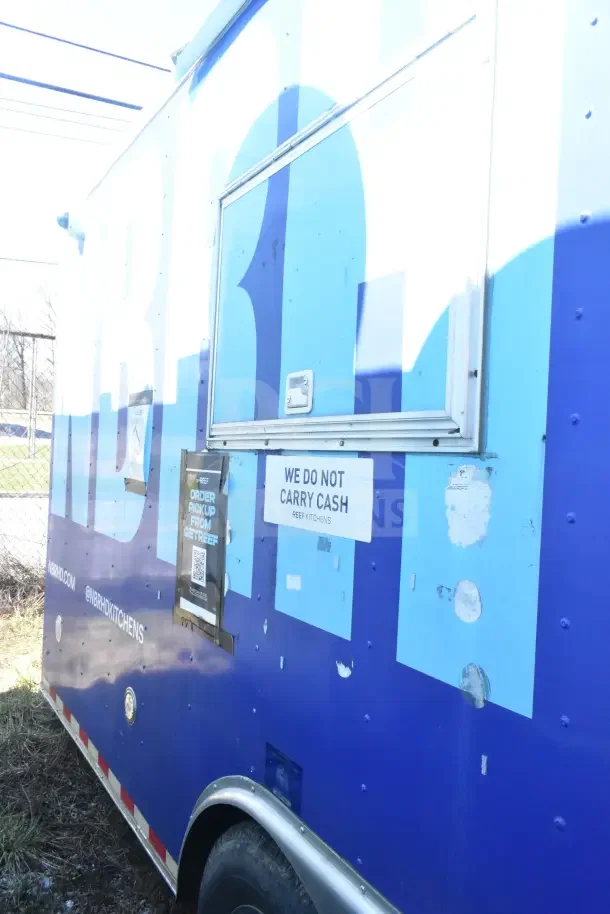 2020 Diamond Cargo 24' commercial kitchen trailer, exterior view with service window and signage. Includes kitchen equipment.