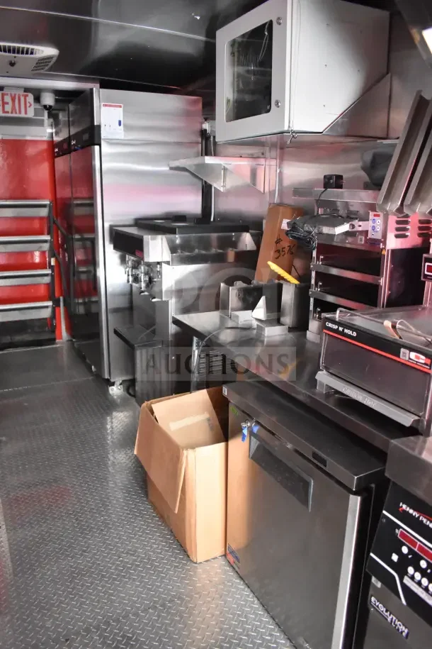 New 2022 Rock Solid Cargo 8.5x28 Ghost Kitchen Trailer with SaniServ shake machine, Henny Penny fryer, Garland griddle, and refrigeration.