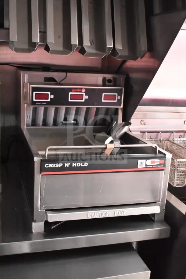 Interior of 2022 Rock Solid Cargo Ghost Kitchen Trailer featuring Wendy’s-configured equipment, including Crisp N’ Hold unit.