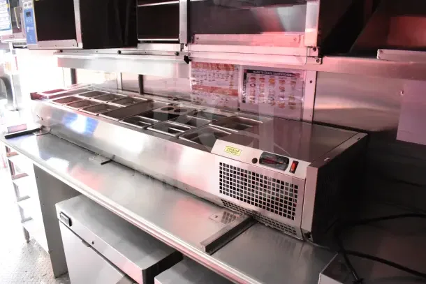 2022 Rock Solid Cargo 8.5x28 Ghost Kitchen Trailer with Turbo Air refrigeration, new condition, includes stainless steel prep area.