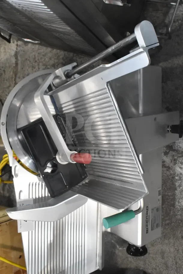 2016 Bizerba GSP HD 13" commercial meat slicer, heavy-duty, automatic gravity feed, illuminated, 120V, good condition.