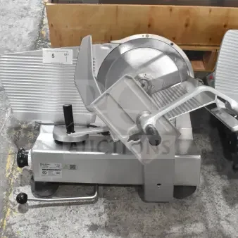 Bizerba SE 12 US Commercial Meat Slicer, 120 Volts, 1 Phase. Silver body, labeled for auction, excellent condition.