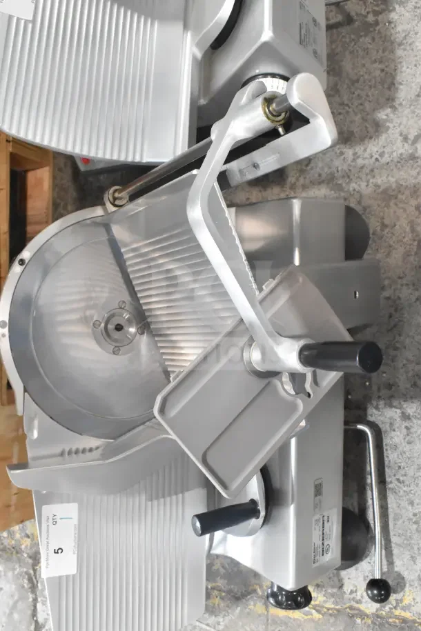 Bizerba SE 12 US Commercial Meat Slicer, 120 Volts, 1 Phase, stainless steel, excellent condition, with label showing model.