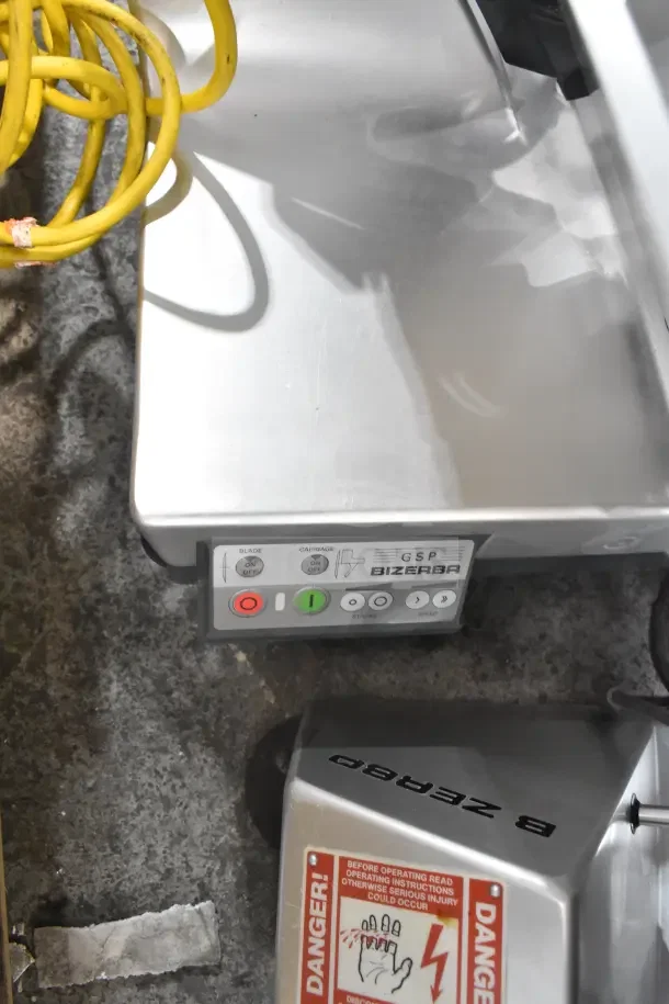 Bizerba GSP HD commercial meat slicer with illuminated controls, 13" blade. Visible warning labels, 120V, 1 phase power.