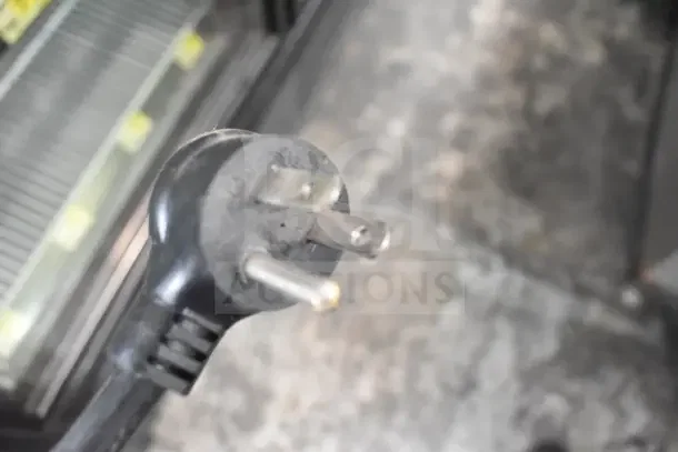 Close-up of power plug for the 2018 True GDM-49-HC commercial cooler, indicating 115 volts, 1 phase.