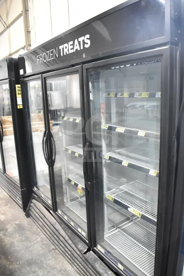 2018 True GDM-72F-HC commercial three-door freezer merchandiser, glass doors, tested and working, labeled "Frozen Treats."
