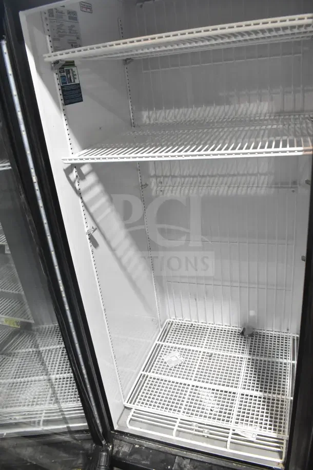 2019 True GDM-49F-HC commercial 2-door reach-in freezer merchandiser, tested and working, with adjustable shelves.