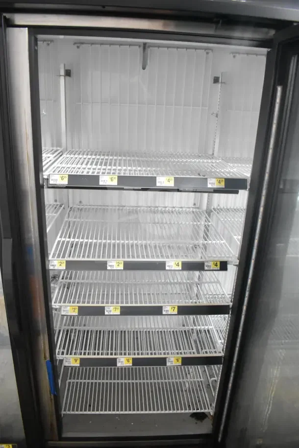 2018 True GDM-72F-HC commercial 3-door freezer, tested and working, featuring adjustable shelves, glass doors, 115/208-230V.