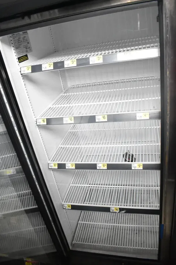2018 True GDM-72F-HC commercial 3-door reach-in freezer merchandiser, tested and working, with shelving and price tags.