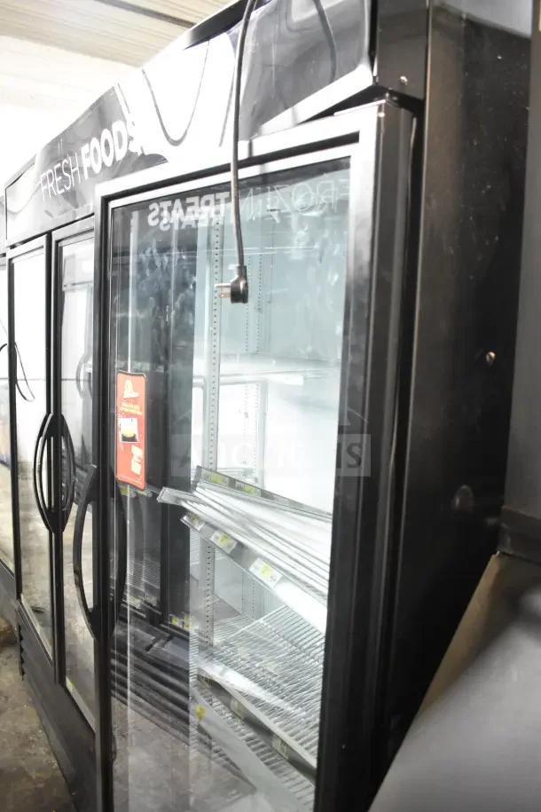 2018 True GDM-72-HC Commercial 3 Door Reach-In Cooler, black frame, glass doors, 115 volts, excellent condition, working.