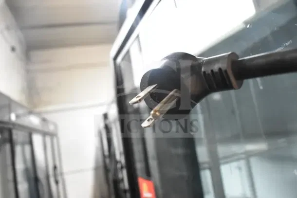 2018 True GDM-72-HC 3 Door Reach In Cooler, 115V, testing plug shown, commercial use, glass doors, working condition.