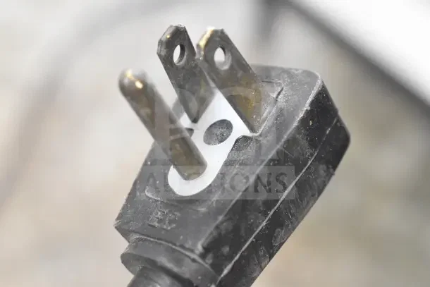 Close-up of power plug for Minus Forty 07-CSGF-X1-HR Mini Freezer Merchandiser, showing a standard three-prong design.