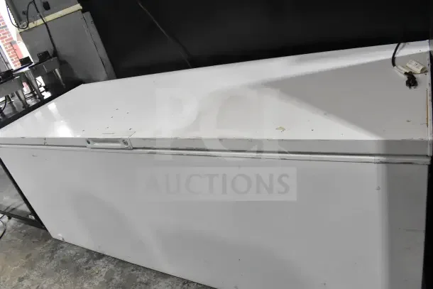 Frigidaire Commercial Chest Freezer, 115 Volts, 1 Phase. White exterior with visible wear, top-access design.