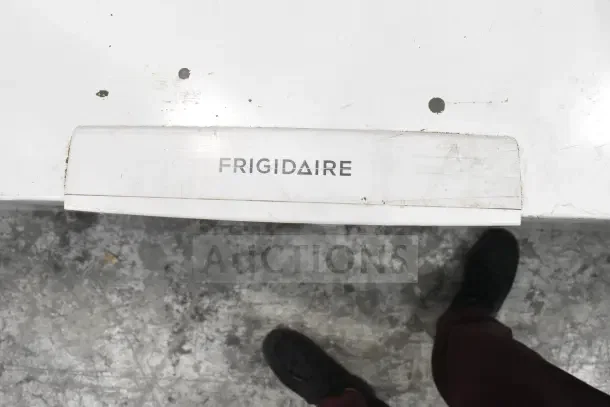 Frigidaire Commercial Chest Freezer, 115 Volts, 1 Phase, visible wear, Frigidaire logo on handle.