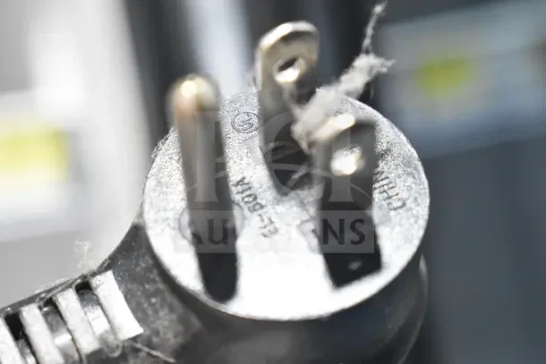 Close-up of a power plug for the 2018 True GDM-72-HC cooler, showing visible prongs and markings.
