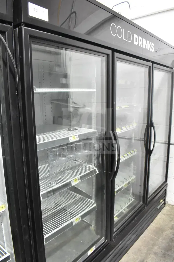 2018 True GDM-72-HC commercial 3-door reach-in cooler, glass doors, black exterior, 115V, 1 phase, "COLD DRINKS" sign.