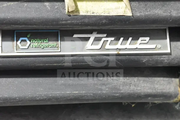 2018 True GDM-72-HC cooler, natural refrigerant label, featuring three doors, 115 volts, 1 phase power.