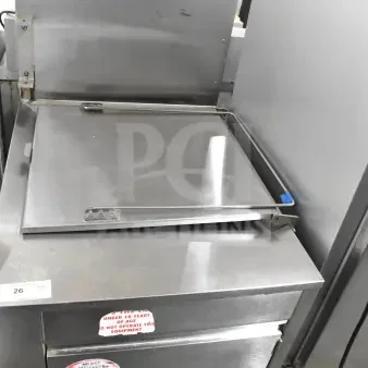 Commercial floor-style donut fryer, stainless steel, top view with closed lid. Warning labels visible, good condition.